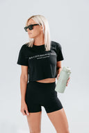 HER Cropped black Tee styled over activewear for everyday wear