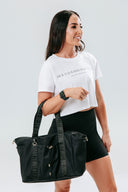 HER Cropped White Tee styled over activewear for everyday wear