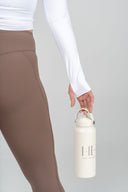 HER insulated stainless steel drink bottle in vanilla, designed for long-lasting temperature control and everyday hydration