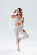 Woman wearing The Pilates Edit — Aura Over Shirt, Crop, and Leggings set for Pilates or everyday wear.