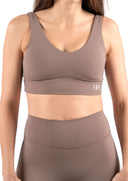 Front view of the Aura Crop in mocha, featuring a flattering V-neckline and soft sustainable activewear fabric