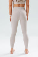 Aura Leggings – V-shaped back seam sculpting active leggings back view - Taupe