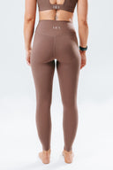 Back view of the Elevate Leggings in mocha, highlighting the flattering fit and supportive high-rise waistband