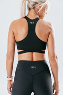 Back view of the Empower Crop on a medium model, showing the supportive cut-out back and sculpting fit