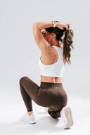 Back view of the Perform Leggings in cocoa, highlighting the sculpting Invisible Scrunch and supportive fit