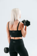 Back view of the Perform Leggings in onyx, highlighting the Invisible Scrunch for a natural sculpted look