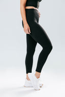 Front view of the Perform Leggings in onyx black, featuring a high-waisted fit, no front seam and sculpting perform fabric