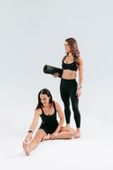 Perform Pocket Leggings in Onyx styled for Pilates stretching and movement