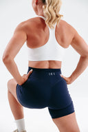 Women’s active pocket shorts in navy with Invisible Scrunch – back view