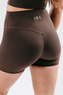 Back view of the Perform Shorts in cocoa, highlighting the Invisible Scrunch for a natural sculpted look