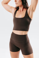 Front view of the Perform Shorts in cocoa, featuring a high-waisted fit, no front seam and sculpting performance fabric
