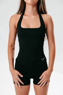 Front view of the Perform Sculpt Halter Tank in black, featuring a scoop neckline and sculpting supportive design
